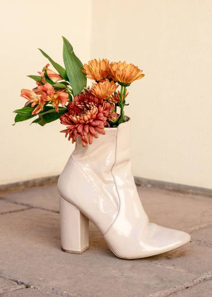istock Beige high-heeled boot with vibrant flowers 2176401646