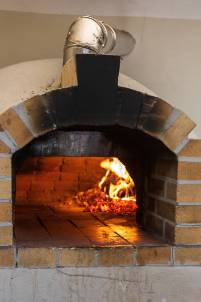 istock Open fire pizza oven. Beautiful brick oven in the restaurant. 2176405346