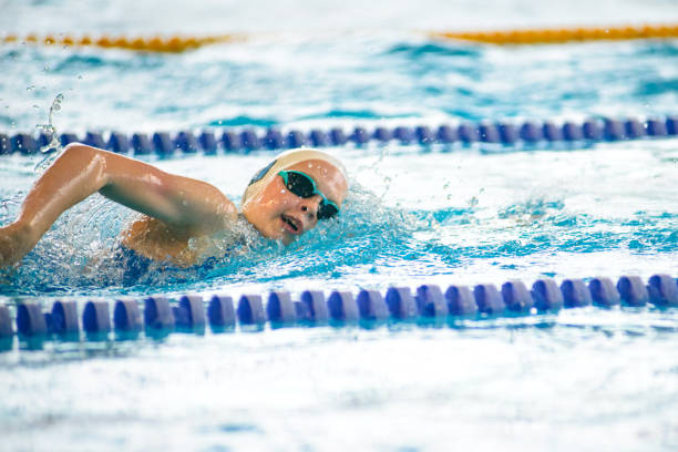 istock Swimmer swims freestyle swimming style in the pool 2176408497