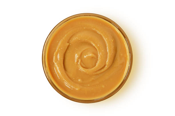 istock Peanut butter in glass bowl on white background 2176412313
