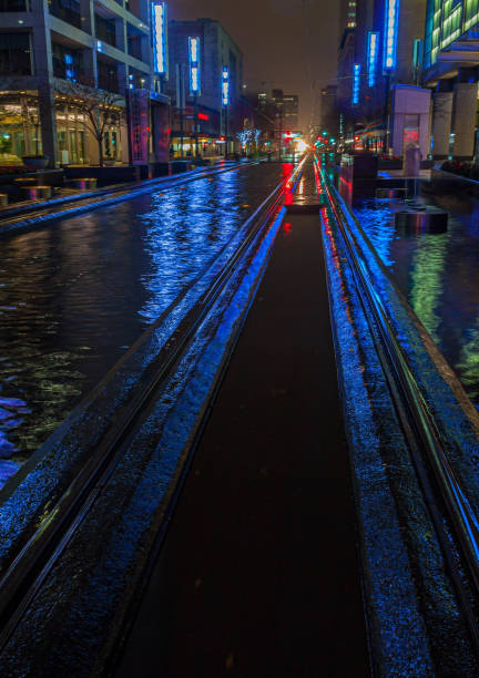 City Lights Reflecting on The Metrorail System  Along Main Street
