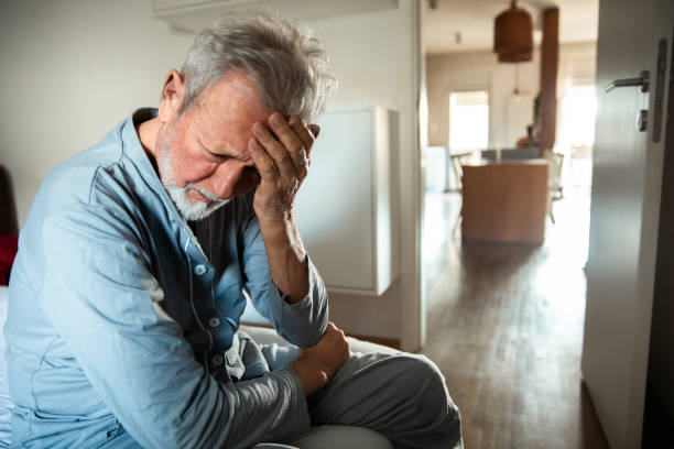 istock Senior man having a headache at home in the bedroom 2176419634