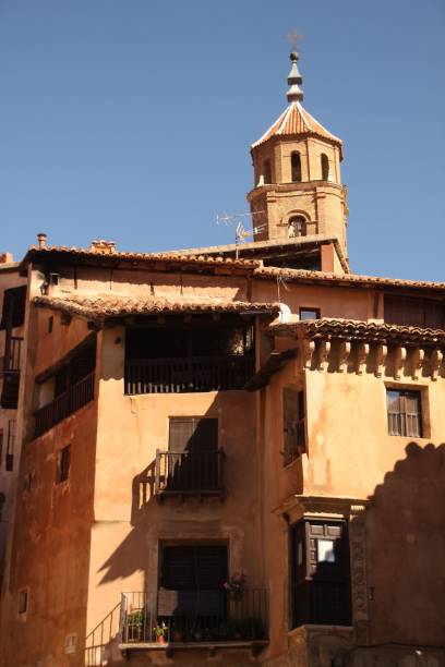 istock Charming rustic building with a bell tower against a clear blue sky in a historic town. 2176420219