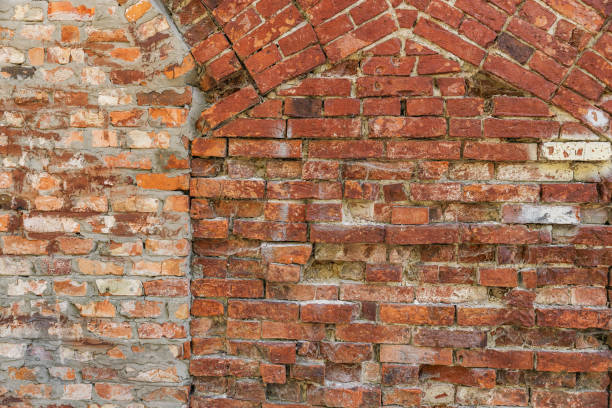 istock Antique brick wall background, ancient red brick masonry surface. Vintage textured background of red brick wall. 2176421999