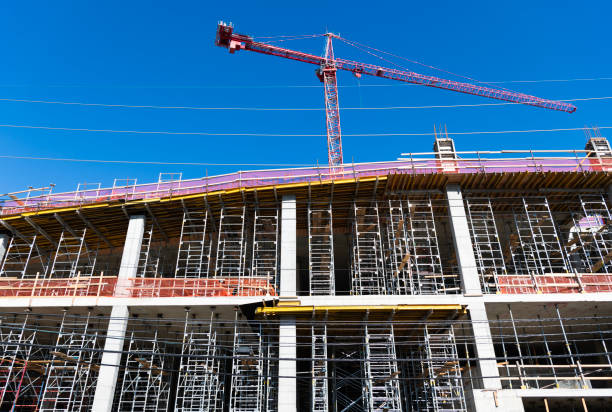 istock Building and construction. Hoisting crane. Construction at building site with crane. Construction crane at building area. Construction site with building crane. Industrial area. Site inspection 2176425493