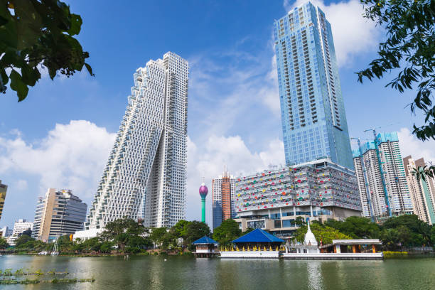 Colombo, Sri Lanka - December 3, 2021: Colombo city view with modern skyscraper towers under blue cloudy blue sky on a sunny day