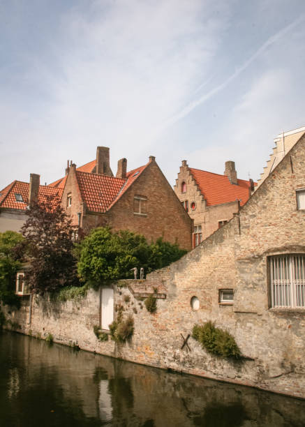 istock Orange brick houses by a canal 2176428478