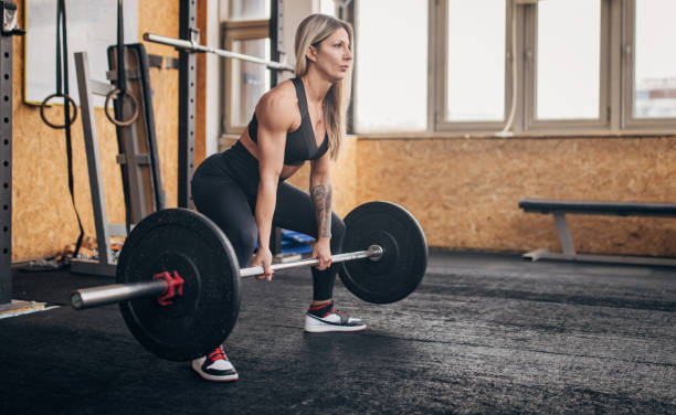 istock Focused lifter readies for deadlift in sunlit gym 2176444397