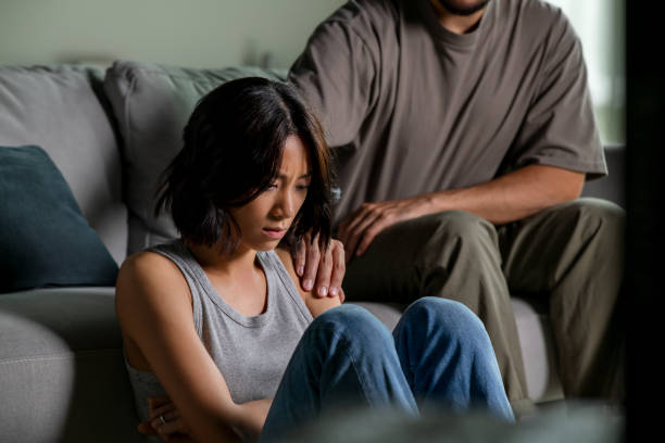 istock Male and female couple going through hard times in relationship problem, showing each other consoling touches, comfort, hugs and soothing gestures 2176446334