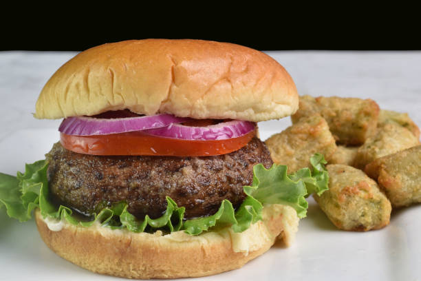 istock mushroom burger with onions and tomatoes 2176446595