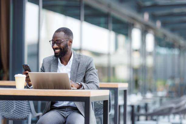 istock Businessman enjoying coffee while working on a laptop outdoors 2176447436