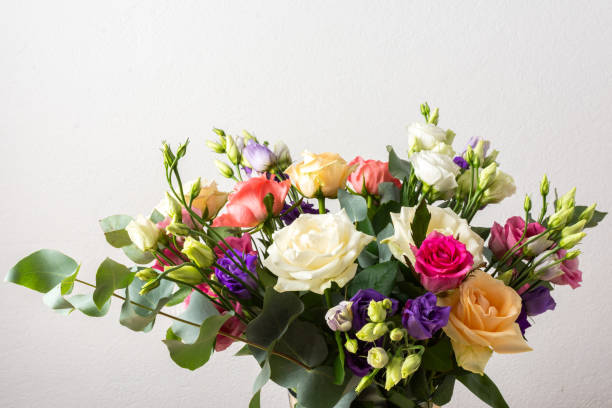 istock Celebrate special occasions with a colorful summer bouquet featuring fresh roses, eucalyptus, and eustoma blooms, creating an elegant and fragrant floral arrangement 2176448324