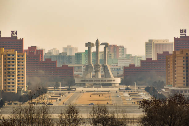 View across Pyongyang to the Monument to the Party Foundation Pyongyang, North Korea - December 25 2018: View across Pyongyang to the Monument to the Party Foundation kim il sung square stock pictures, royalty-free photos & images