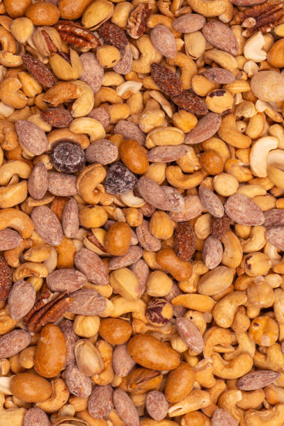 istock A group of almonds, pistachios, walnuts, macadamia, cashews. 2176453621