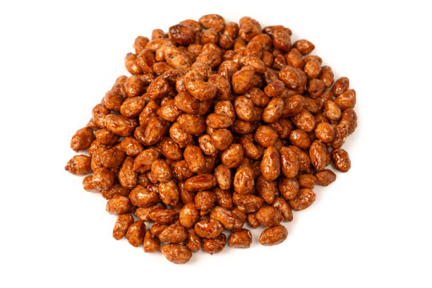 istock Tasty sweet roasted peanuts isolated on a white background. 2176453651