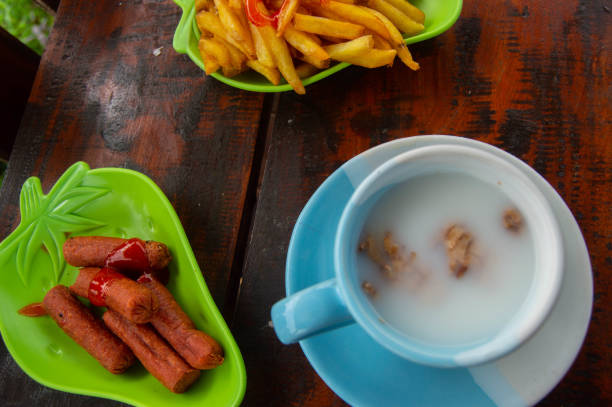 istock shot on fried sausage with tomato sauce served on a wooden table 2176457421