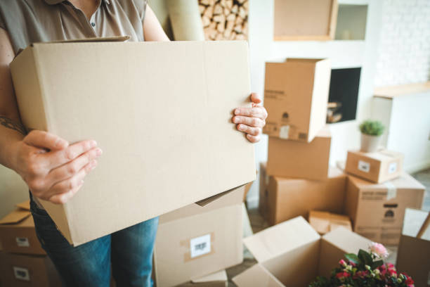 istock Mature woman with Moving Boxes in New Home 2176457883