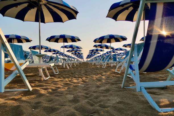 istock Rows of white and blue beach umbrellas in Rimini 2176458251