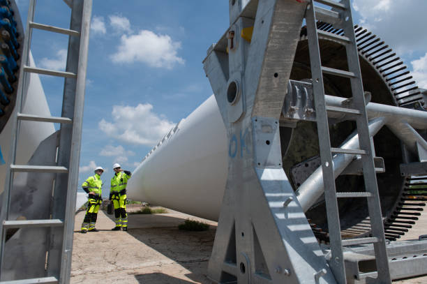 istock Wind Turbine Maintenance and Repair Technician, Engineer Checking Turbines working maintenance clean power generator system 2176460216