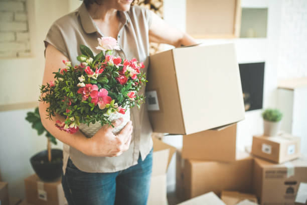 istock Mature woman with Moving Boxes in New Home 2176460331