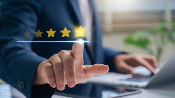 istock Customer Satisfaction, Digital rating concept. businessman in a suit selecting a five-star rating on a digital interface, representing customer feedback and satisfaction assessment. 2176461229