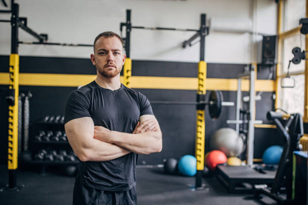 istock Fit man with serious expression in modern gym 2176464811