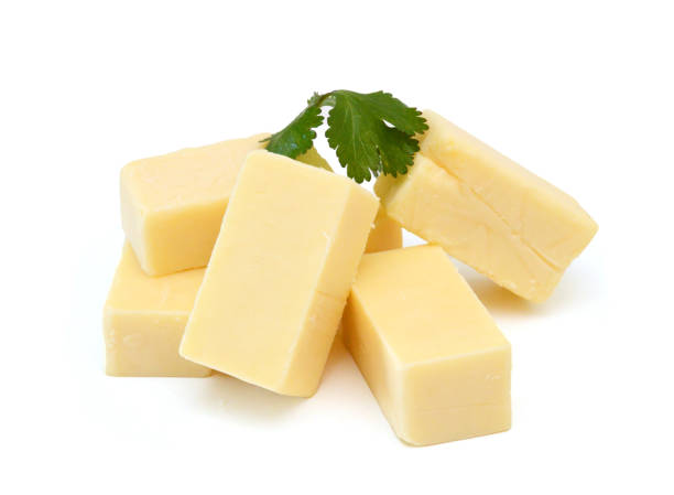 istock Cubes of cheddar cheese isolated in basket on white 2176465003