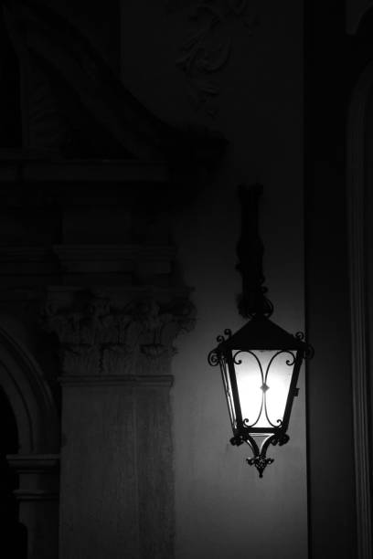 A modern street lamp on a city street at night. Light bulbs in the dark. Street lights close-up at night