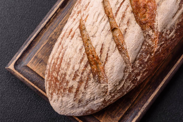 istock Brown bread with seeds, grains, salt and spices 2176470316