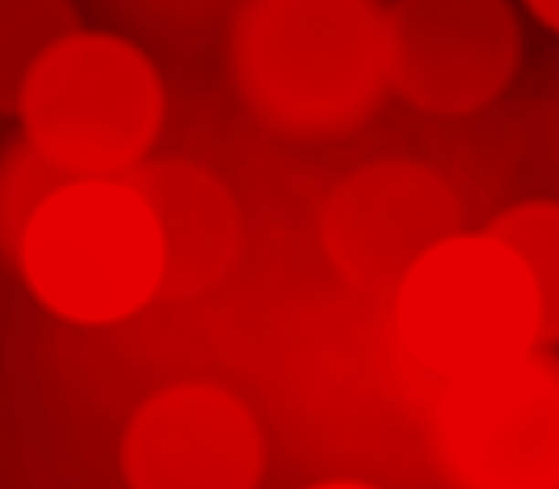 istock Red glowing blurred festive bokeh as background 2176472625