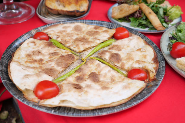 istock Enjoy a flavorful quesadilla garnished with fresh cherry tomatoes and bright bell peppers 2176476111