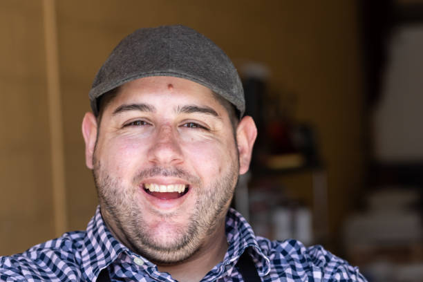 istock Laughing man wearing a cap looking at the camera 2176478413