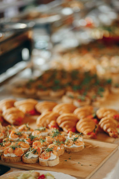 istock Shrimps canape sandwich on wooden board 2176479956