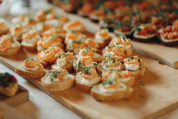 istock Shrimps canape sandwich on wooden board 2176479959