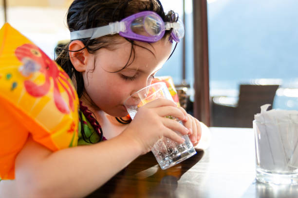 Girl drinking water.
