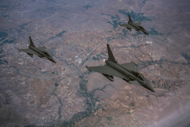 istock Jet aircraft flying over mountains. 2176482798