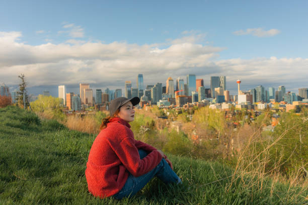 istock Woman looking at  Calgary cityscape from park 2176486228