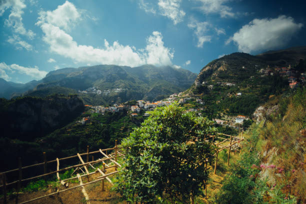 Interior view of the vegetation and mountains of Capri, Amalfi and Ravello.Spectacular Capri Island in Italy. Sea view with boats, yachts and promontory, cliff and sun reflections on the water. Summer day. Paths over the rocks, serenity and tranquility of the summer heat. Romantic walk with vacation. One of the most beautiful places in the world.