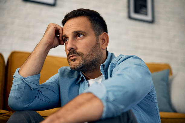 istock Pensive mid adult man at home. 2176488913