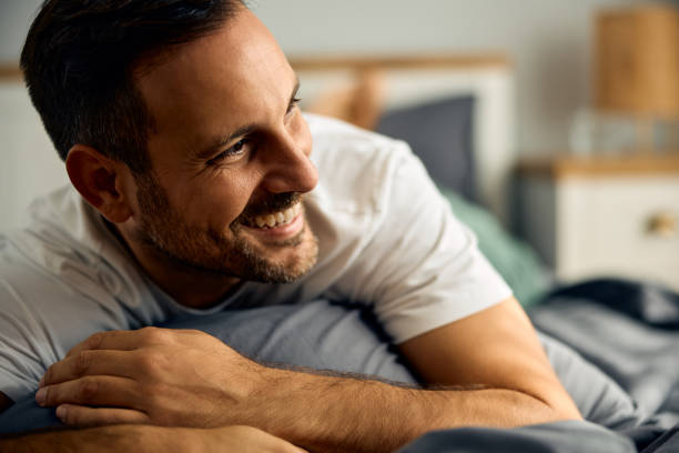 istock Happy man relaxing in his bedroom. 2176490070