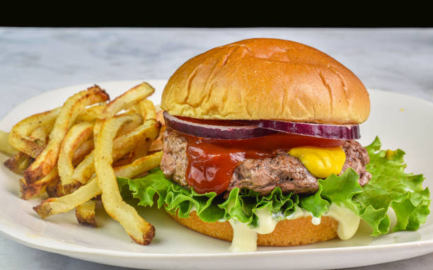 istock hamburger  top with   onions , mustard and ketchup 2176491887