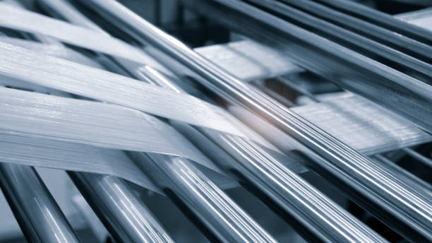 istock synthetic textile thread,  thread at industrial weaving manufacturing machine,  textile fabric production industrial concept background 2176498902