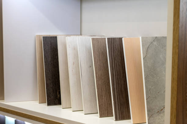 istock Wooden and stone flooring samples displayed on a shelf. 2176501598