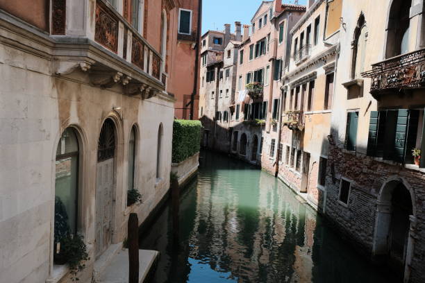 istock A small, enchanting canal is located between two buildings in Venice 2176501847