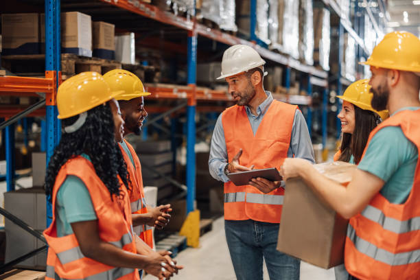 istock Diverse warehouse team discusses strategy for operations 2176507528