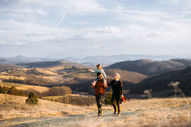 Happy Family Enjoying Mountain Vacation on Scenic Path