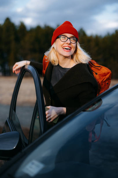 istock Happy Woman Enjoying Mountain Vacation with Backpack 2176509879