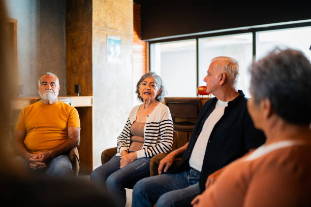 istock Senior woman talking to therapy group 2176510363