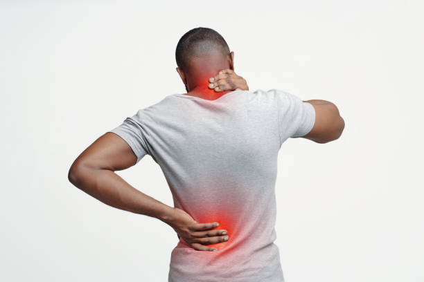 istock Black guy rubbing his painful neck and back 2176511906