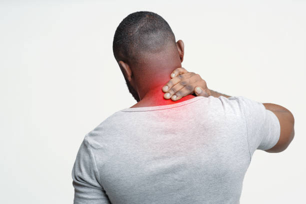 istock Afro man with neck pain, back view 2176511912